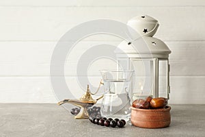 Decoration and food of Ramadan Kareem holiday on grey table