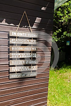 Decoration on a garden shed. Hanging signs in Dutch photo