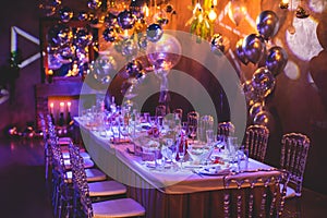 Decoration interior elements of restaurant venue banquet hall with multicoloured different helium balloons, on a indoor corporate
