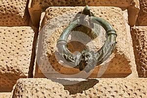 Decoration ring on the wall of Palacio de Carlos V in La Alhambra, Granada, Spain