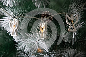 decoration on snowy Christmas tree