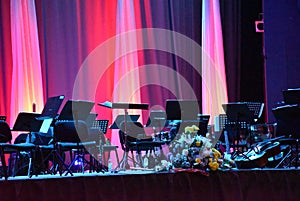 Decoration on the stage as a still life decorative flowers with colored curtains in the background