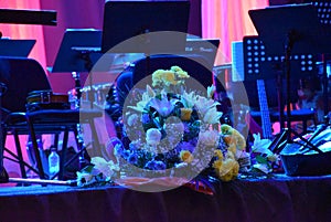 decoration on the stage as a still life decorative flowers with colored curtains in the background