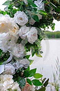 Decoration of the wedding ceremony with an arch of flowers