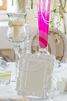 Decoration of wedding table with decorative frame