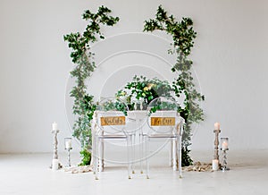 Decoration of the wedding table with flowers and branches in the botanical style