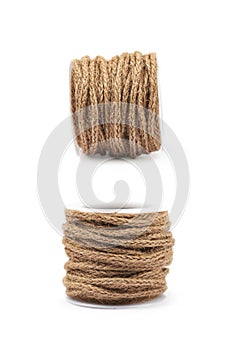 Decorational rope string on a bobbin