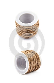 Decorational rope string on a bobbin