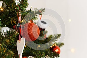 Decorations and balls on the Christmas tree at home. copy space