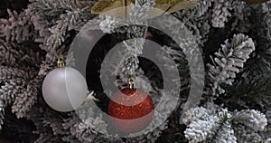 Decorations on the Christmas tree. The concept of winter holidays.