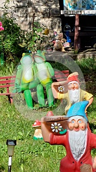 Decorations in a garden with close-up on 2 dwarfs