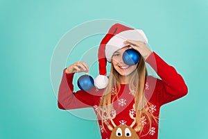 Decorative accessories. Decorating christmas tree. Girl smiling face hold balls blue background. Let kid decorate