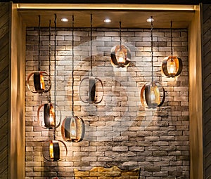 Decorative antique edison style filament light bulbs on brick wall