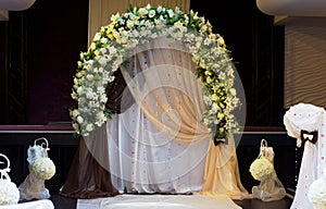 Decorative arched white floral bridal bower