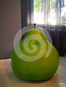 Decorative artificial pear in a room