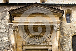Decorative bas-reliefs over the entrance in Prague photo