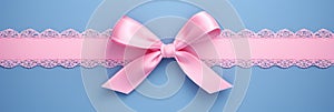 Decorative beautiful pink satin ribbon with bow for decorate gift box or greeting card on light blue background