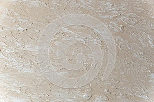 Decorative Beige putty sample on the wall. decorative plaster concrete textured background. Textured