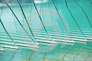 Decorative beveled and tempered glasses in an ornamental pool