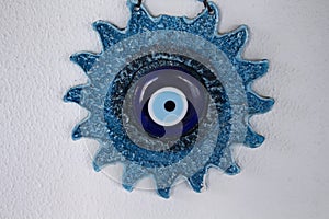 Decorative, blue wall object in shape of sun