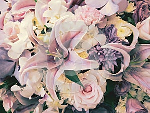 Decorative bouquet of lily and other beautiful flowers, adjusted to vintage color tone.