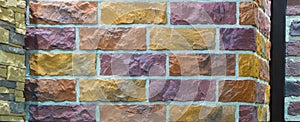 Decorative brick wall from concrete facing tiles as background or texture