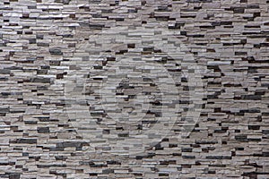 Decorative brick wall from concrete facing tiles as background or texture
