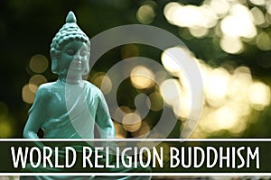 Decorative Buddha statue and text World Religion Buddhism on blurred background