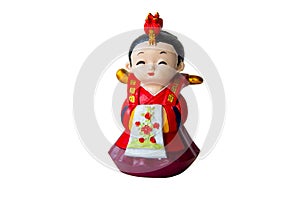 A decorative ceramic Korean figure, a female in traditional colorful clothes Han bock.