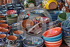 Decorative ceramic plates with traditional uzbek ornament in the street market of Bukhara. Uzbekistan