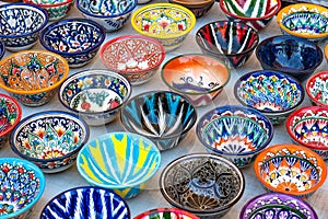 Decorative ceramic plates with traditional uzbek ornament in the street market of Bukhara. Uzbekistan