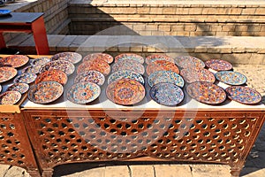 Decorative ceramic plates with traditional uzbekistan ornament on street market, Central Asia, Silk Road