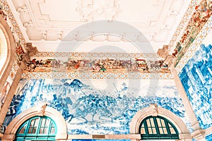 Decorative ceramic wall tiles in the main hall of Sao Bento Railway Station in Porto, Portugal.