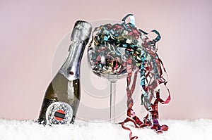 Decorative champagne bottle on a pink background