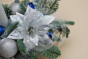 Decorative Christmas Arrangement with Pine Fir Branches, Big Silver Flower and Baubble, Globes and Blue Ribbons.