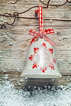 Decorative Christmas bell on a rustic background