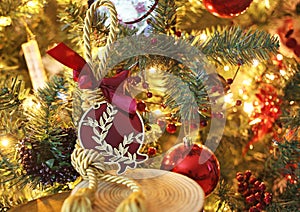 Decorative Christmas pomegranate in front of the Christmas tree