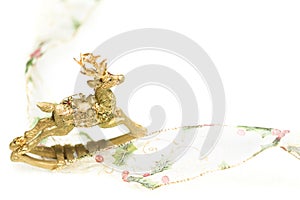 Decorative Christmas Reindeer Ornament and Ribbon on White