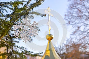 Decorative Christmas snowflake on the background of the Orthodox cross. The concept of Orthodoxy.