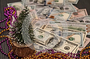 Decorative Christmas Tree of small size near the dollar of kopeck`s currency. Corporate income