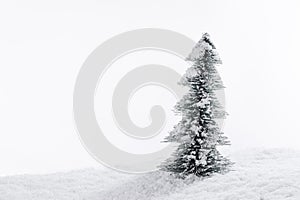 Decorative Christmas tree in snow