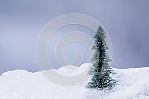 Decorative Christmas tree in snow