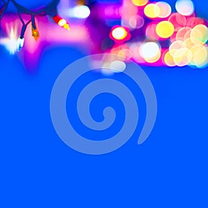 Decorative Colorful Blurred Christmas Lights On Blue Background. Abstract Soft Lights. Colorful Bright Circles Of A Sparkling Garl