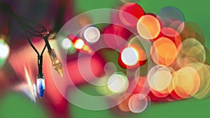 Decorative Colorful Blurred Lights On Green Background. Christmas Abstract Soft Lights. Colorful Bright Circles Of A Sparkling