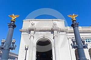 Decorative columns with eagle statues on top in front of the Union Station in Washington DC, USA.