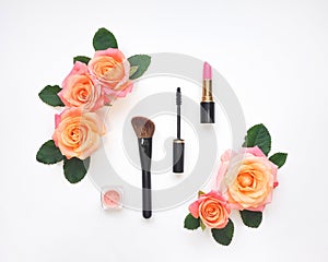 Decorative composition with cosmetics and rose flowers. Top view, flat lay