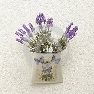 Decorative container with butterflies and lavender flowers