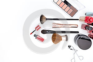 Decorative cosmetics, makeup products and brushes om white background