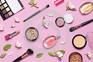 Decorative cosmetics mascara powder lipstick eyeshadow blush balls makeup brush perfume blooming spring branches on pink