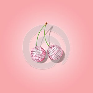 Decorative disco balls like cherries on pink background. Minimal party concept